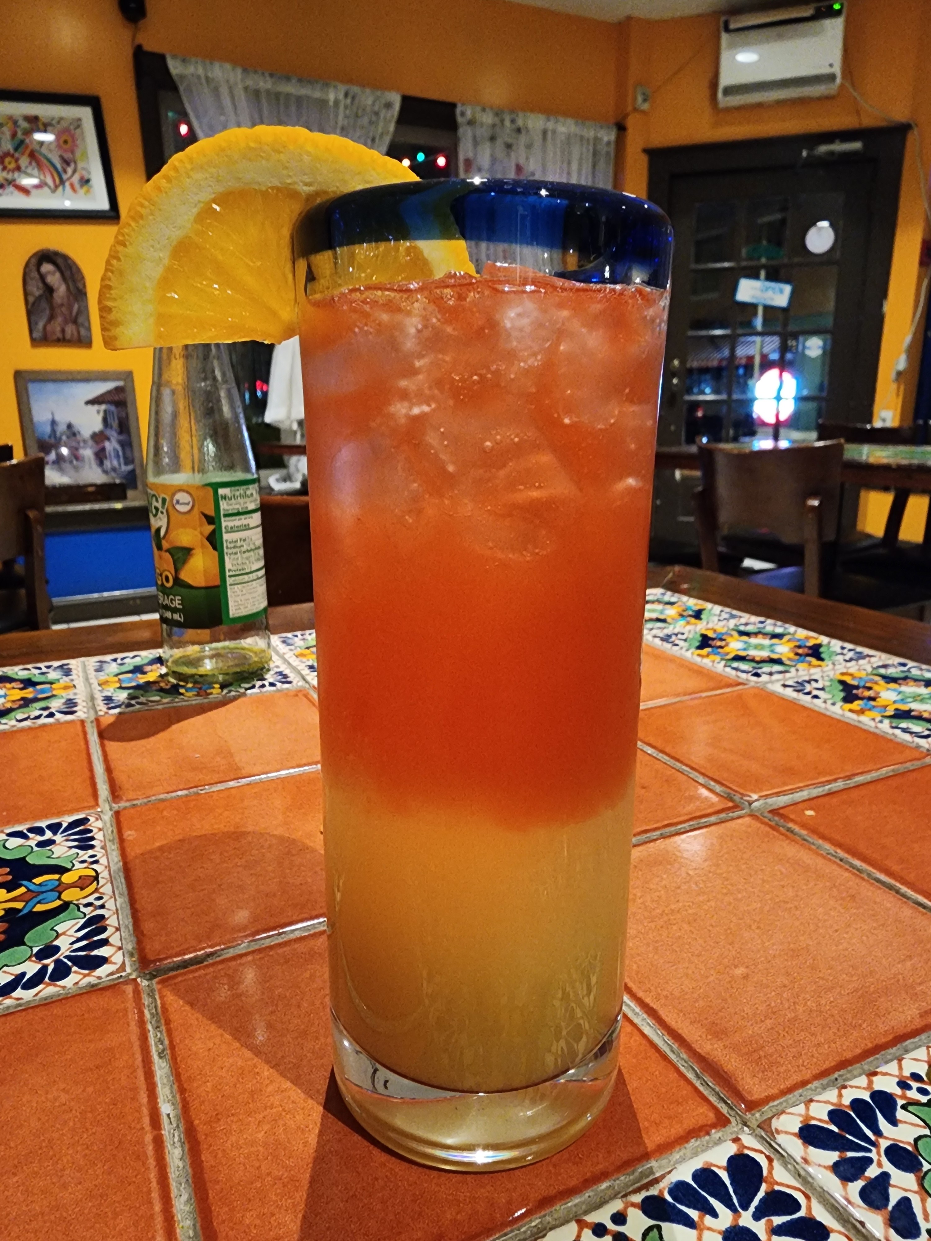Agua de jamaica en mesa talavera — Los Cuatro Soles Point Breeze